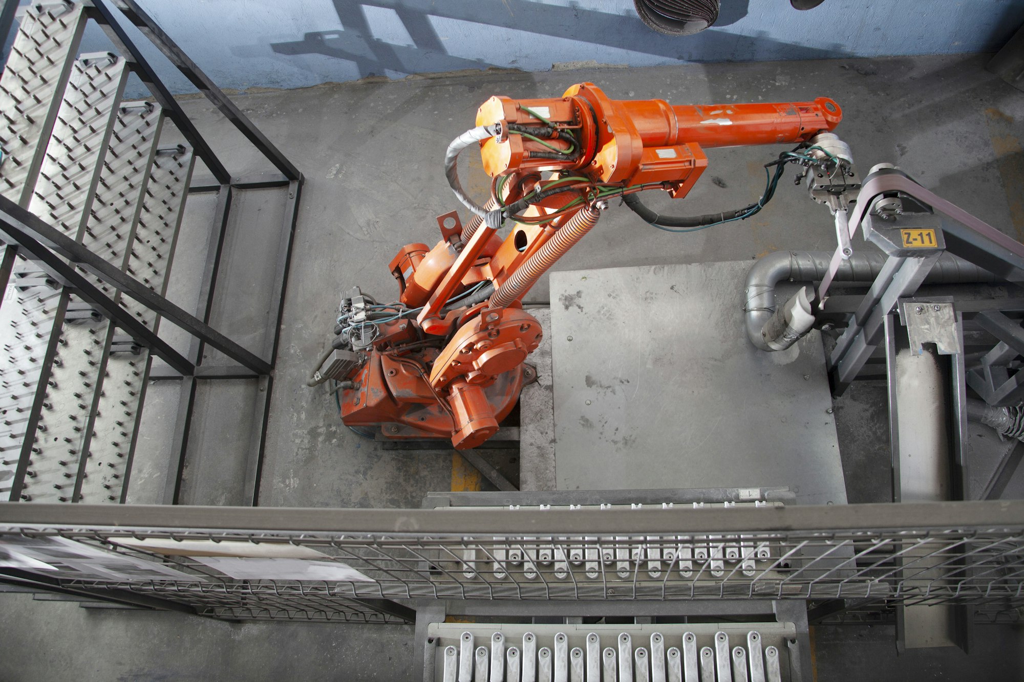 Robotic arm at industrial manufacture factory.